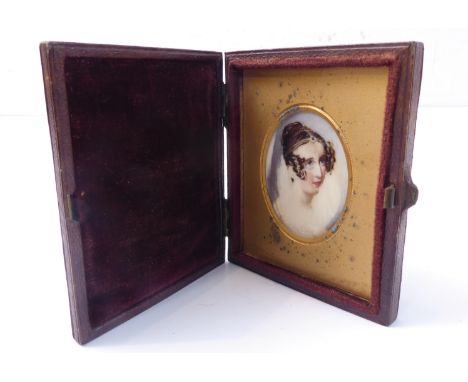 A 19th century portrait miniature of a young lady, in original hinged caseCondition not good, badly painted close up and pain