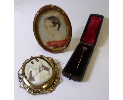 A late 19th century cameo brooch, a stick pin set with small white stones (cased) and a portrait miniature of a lady in oval 