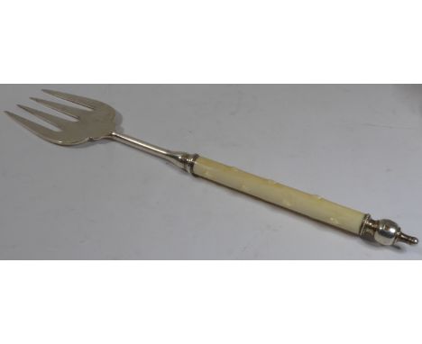 A hallmarked silver muffin fork with an ivory handle