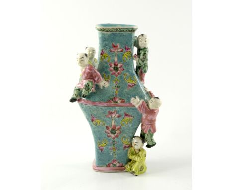 A Chinese baluster vase, 20th Century, with five boys climbing, famille rose foliage on a turquoise scroll ground, three char