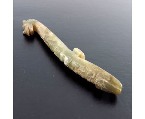 A Chinese pale jade belt hook, probably Qing period, dragon head terminal, carved scales, length 11cm