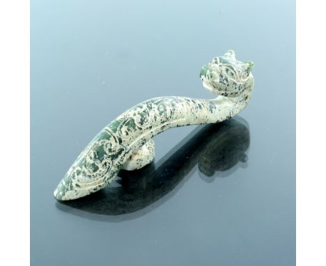 A Chinese dark green jade belt hook, carved dragon head terminal and incised scales, length 10.5cm