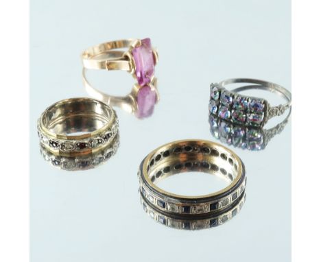 Four gem-set rings, to include a Russian 14ct gold pink gem ring, two 9ct gold and silver full eternity rings and a gem-set r