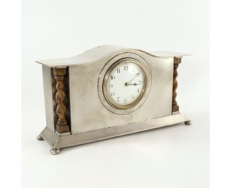 Liberty and Co., an Arts and Crafts Tudric pewter mantle clock, model 01126B, the 3.5 inch white enamel dial with Arabic nume