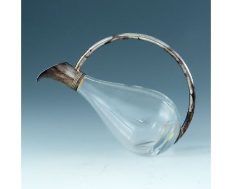 A Modernist silver and glass claret jug, Asprey and Garrard, London 2000, the plain teardrop body with tubular looped handle 
