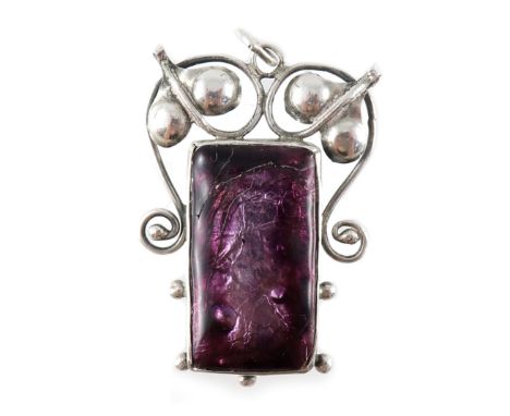 An Arts and Crafts silver and enamel pendant, the rectangular purple foil enamel plaque, within a beaded frame, suspended fro