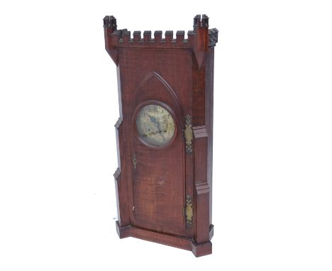 A Victorian Gothic Revival oak bracket clock, the case modelled with crenelated turrets and lancet arched door, the brass dia