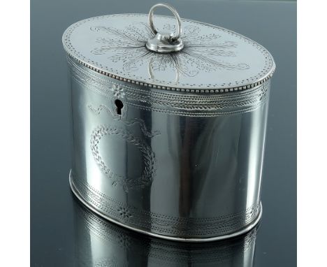 A George III Old Sheffield Plate tea caddy, circa 1780, straight sided oval form, bright cut with foliate bands, the flat lid