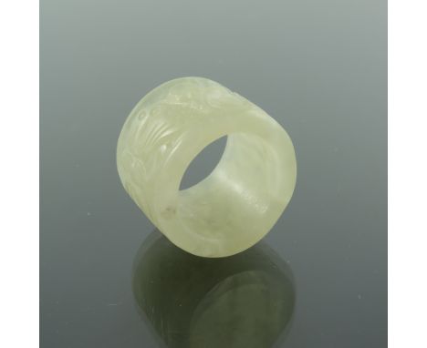 A Chinese carved jade archers ring, decorated with butterflies and scrolls, 2.5cm high, 3.5cm diameter