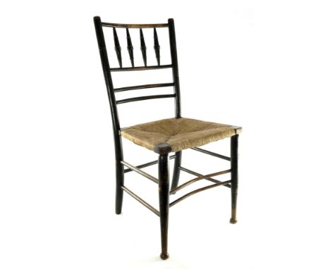 Liberty and Co. after Philip Webb for Morris and Co., an ebonised Sussex chair, circa 1880s, the turned, incised and steam be
