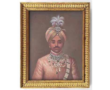 Indian School (early 20th century), portrait of an Indian Maharaja, bust length wearing a jewelled turban and tunic, oil on b
