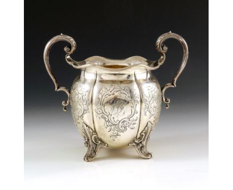 A Victorian silver twin handled bowl, Henry Wilkinson and Co., Sheffield 1848, lobed melon form with crimped rim, acanthus ea