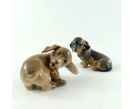 Two Royal Copenhagen figures of dachshund puppies, model 3140 and 1238, printed marks, 8cm high (2)