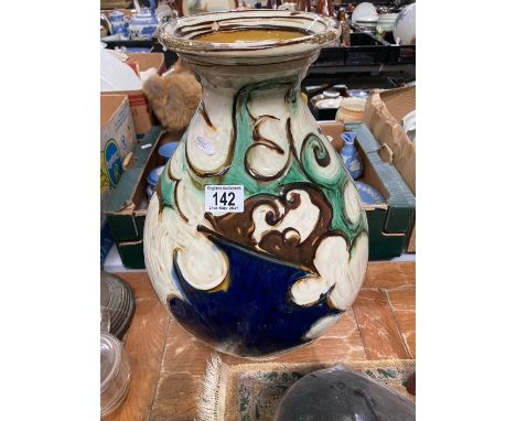 A George V silver teapot, Robert Pringle, Birmingham 1932, ogee boat form, wooden scroll handle and finial, on squat bun feet