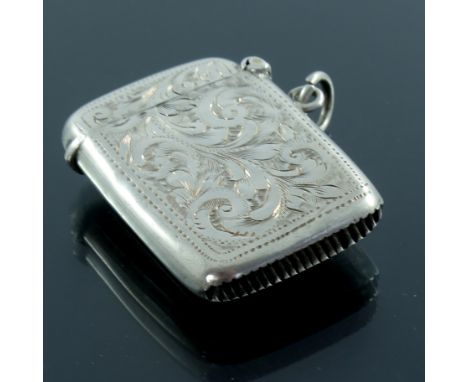 An Edwardian silver stamp vesta case, William Light, Birmingham 1906, single hinged lid with rigid flap, chased foliate scrol