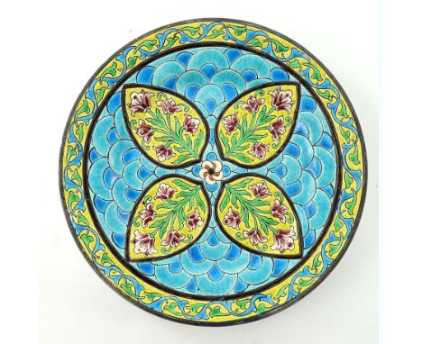 A Longwy art pottery plate, decorated in the Oriental style with cloisonne type enamels, four stylised leaf cartouches with l