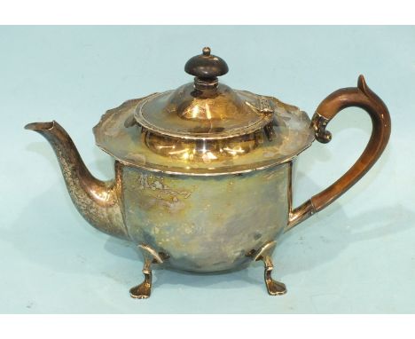 A Late-Victorian silver teapot with shaped rim, on four pad feet, Sheffield 1896, total weight ___18oz.