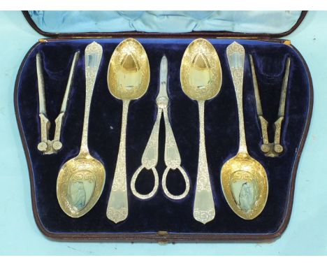 A Victorian silver plated dessert set by Harrison Brothers & Howson, comprising three serving spoons, two pairs of nut cracke