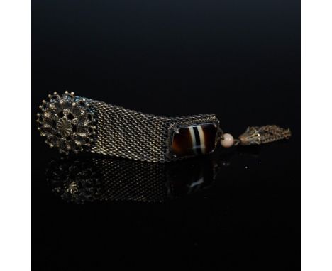 Ornate Victorian Revival mesh chatelaine brooch featuring a richly detailed floral rosette top and a dangling tassel accent. 