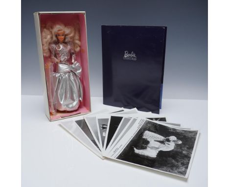 A 9pc Barbie collector set featuring a 1980s style Barbie doll in a silver metallic evening gown with voluminous hair, housed