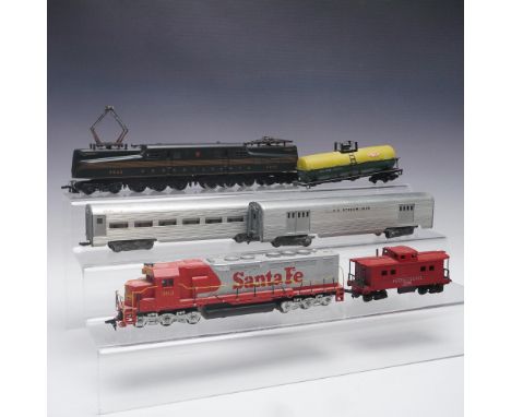 Large collection of over 50 HO scale model trains and cars, including locomotives, passenger cars, cabooses, and freight cars