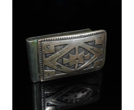 This sterling silver money clip features a traditional Navajo geometric design, hand-stamped with intricate precision. The ba