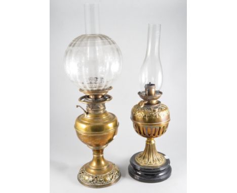 The New Rochester, an American brass oil lamp with shade and chimney, 63 cm overall, and another brass oil lamp, (2)