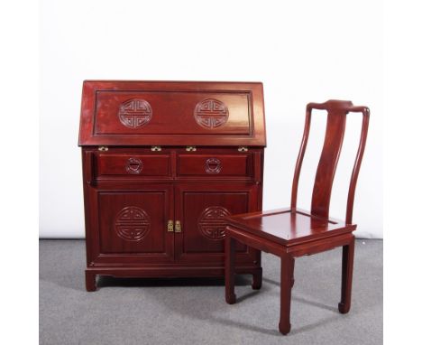 Chinese hardwood bureau and matching single chair, the bureau fall front with carved roundel motifs, repeated on the panel cu