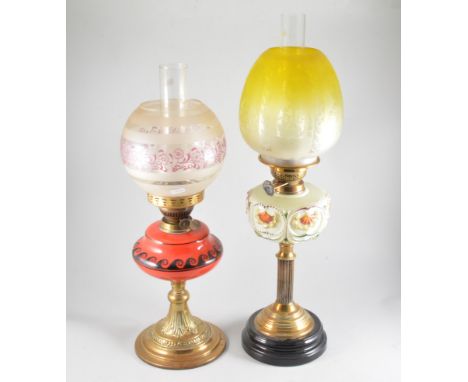 Cast metal oil lamp amber glass reservoir with pear shape shade, 51cm and two other oil lamps, with coloured glass reservoirs