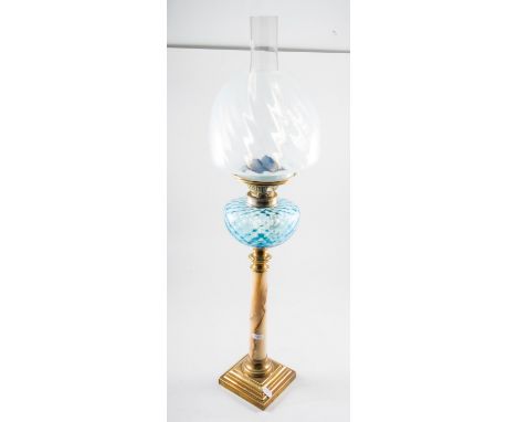 A brass and alabaster oil lamp, honeycomb moulded blue glass reservoir with chimney and vaseline glass shade, 77cm overall.