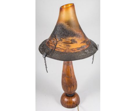 African table lamp, carved bamboo base, amber tinted shade, 77cm overall.