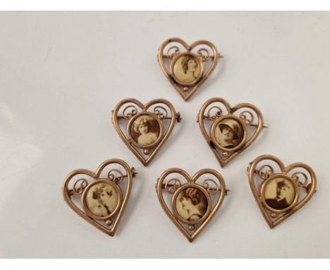 A unusual set of six gilt heart shaped vintage portrait brooches