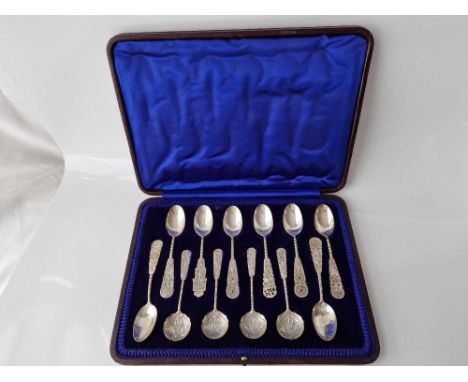 A Chinese silver set of twelve spoons in fitted case by GE