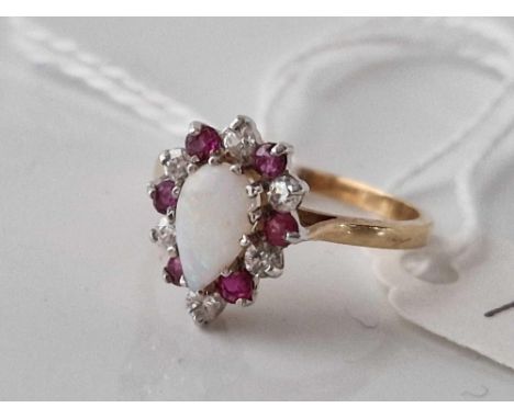 A opal and stone ring 9ct size M 2.2 gms