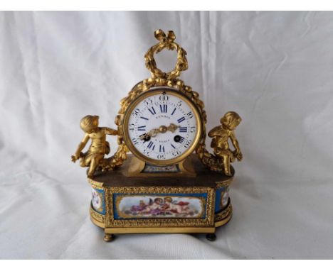 A decorative French mantel clock with porcelain panels, circular dial signed Lenoir, Paris, 9.5" high