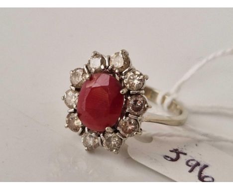 A RUBY AND DIAMOND CLUSTER RING 18CT GOLD SIZE P