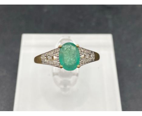 A attractive emerald and diamond ring 10ct gold size S 2 gms