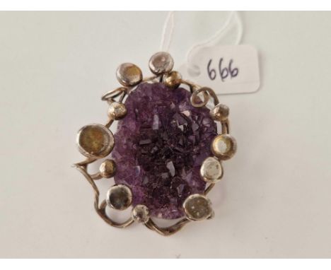 A large silver amethyst pendant