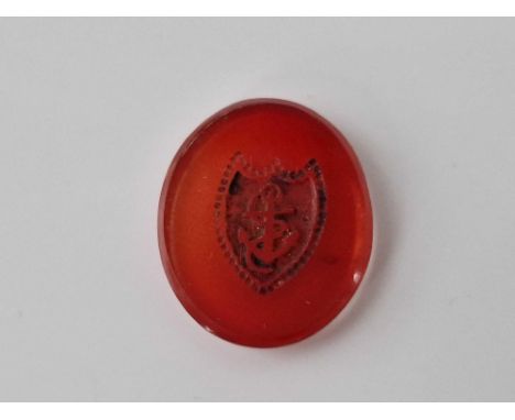 A oval carnelian hard stone with shield intaglio