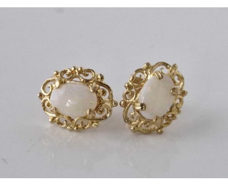 A pair of opal set stud earrings 9ct