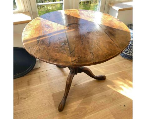 An Early 19th Century Yew wood pillar table on turned stem with tripod base, 36" wide