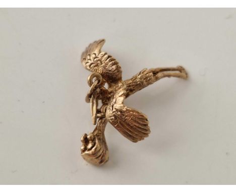 A vintage stork and baby charm 9ct 2 gms