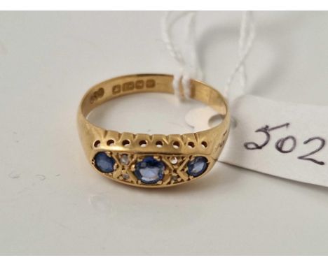 A seven stone sapphire and diamond ring 18ct gold 3.3 gms
