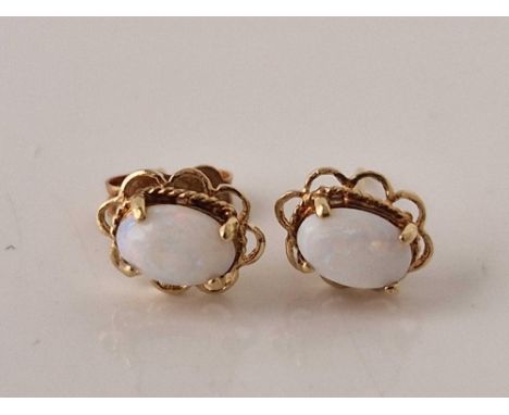 A pair of opal stud earrings 9ct