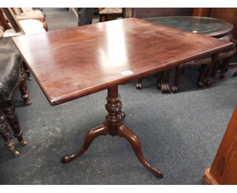 An Early George III mahogany pillar table with square top and carved baluster stem, three splay feet, 29" wide