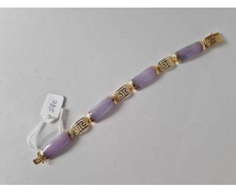 A gold and lavender jade link bracelet 14ct gold 7 inch