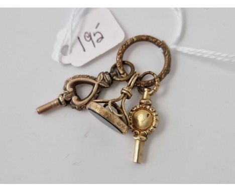 Two watch keys and fob seal on a split ring