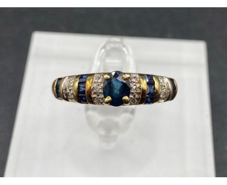 A sapphire and diamond fancy ring 14 ct gold size P 2,4 gms