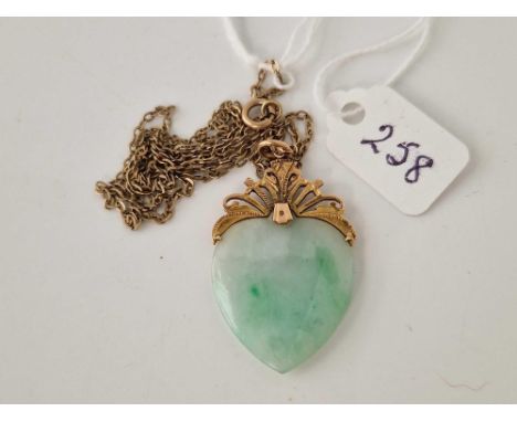 A jade heart 14ct gold pendant on 9ct neck chain 20 inch
