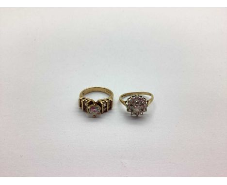 A 9ct Gold Dress Ring, the claw set stone set between stone set tapered shoulders, together with another 9ct gold cubic zirco